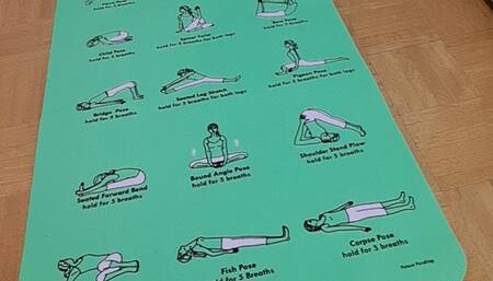 Stretching on yoga Ball in white tshirt with no bra