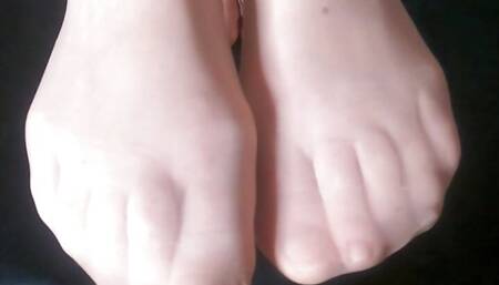 Footplay in tan stockings