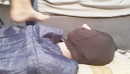 Resting feet on face while reading a book