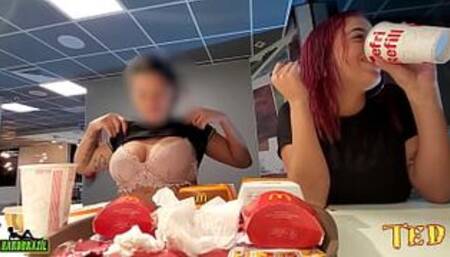 Two naughty girls making out with their breasts out while eating at McDonald's - Official Tattooed Angel