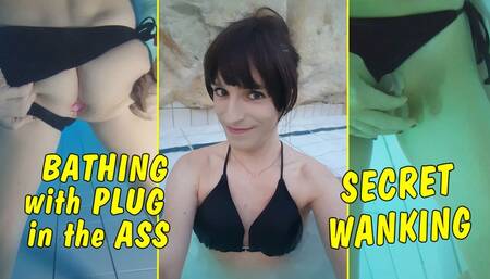 Tranny Girl with plug in the ass while bathing in the hermal bath! Secret wanking!!