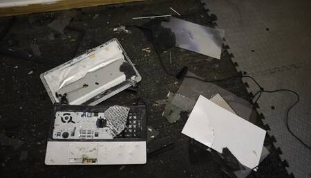 Laptop crushing with black metal heel metal tipped stiletto high heels