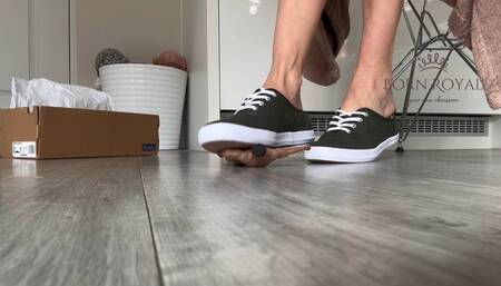 Giantess in sneakers finds tiny man in her shoe