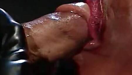 Busty ebony in fetish latex gear rides a white hard cock