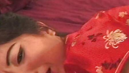 Asian slut has interracial sex with white stud on the bed