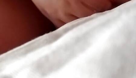 I'm caressing my chest on the bed