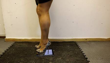 smashing the iPad under my Snake Skin metal heel metal tipped stiletto high heels