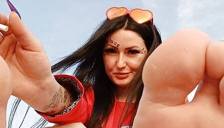 Foot fetish on the beach by the sea. Dominatrix Nika smokes and seduces you with her feet and toes