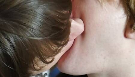 Young gay couple deep french kissing