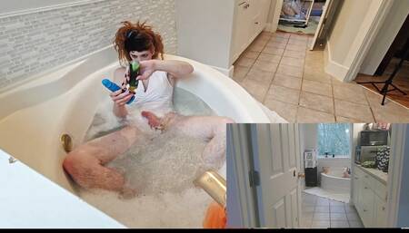 Playing with a dildo in the tub