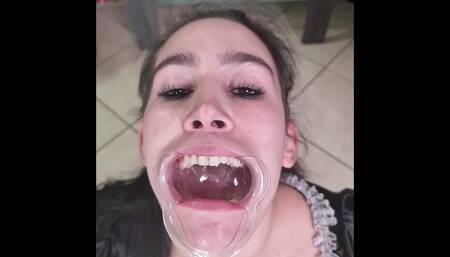 French maid tries to swallow her own piss through lip retractor