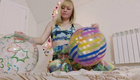 Alla rides hotly on two rare beach balls and gets real pleasure from this ride and lets all the air out of her inflatable toys!!!