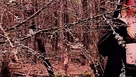 Naughty witch is playing with a vibrator in the forest