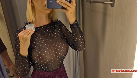 Trying on completely transparent clothes in the fitting room. Look at my boobs in a public place.