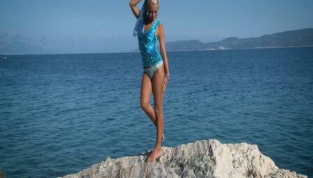 848 Lea Tyron in shinny blue dress make striptease in rock