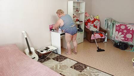 Mother-in-law vacuums the room naked