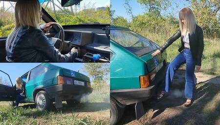 Anastasia plays with exhaust fumes in platform sandals