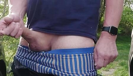 Publicly outside, I jerk my hot cock between cars in a commuter parking lot. But unfortunately cars kept coming by.