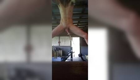 Outside stretching my cock with weights