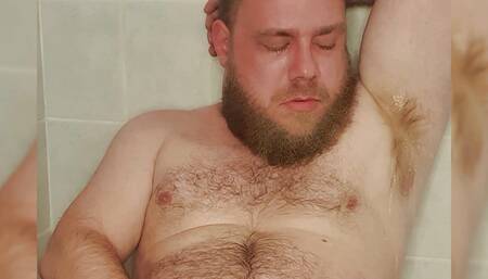 The gay pig's piss just sprays out of his hairy cock straight into his face