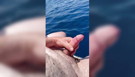 Wanking and cum at the sea