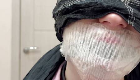 Tape tied to chair, ball gagged