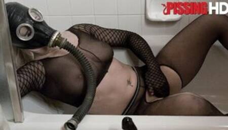 Hot blonde in a gas mask gets peed on