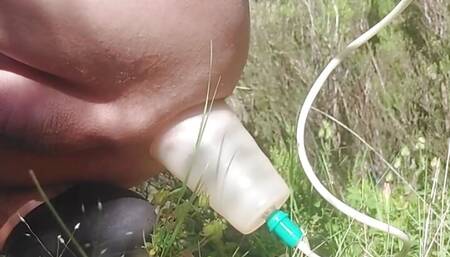 Pumping and stretching ass lips in the nature