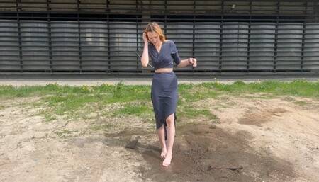 girl is trapped tied, she wants to break free, but her legs slip in the mud