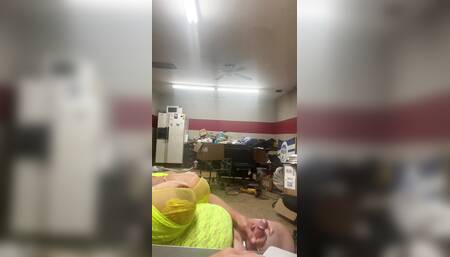 Voyeur view of big dick crossdressing bear cumming at work.