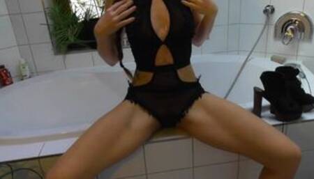 sporty girl in high heels does an enema in the bathtub
