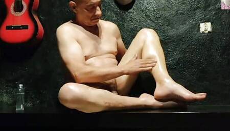 TUGA MALE PASSES OIL ON HIS LEGS