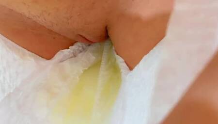 A beautiful girl can't hold pee in a diaper POV