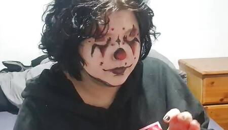 Clown girl Blowing up and popping huge balloon