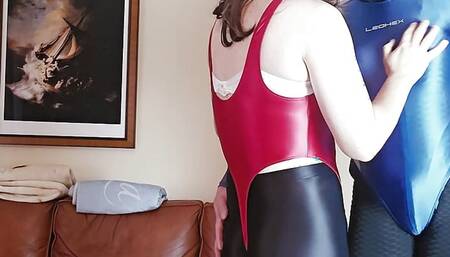 Two Crossdressers in Shiny Spandex Leotards Playing