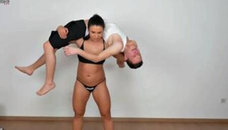 Hot strong brunette lift a guy and kick his ass off