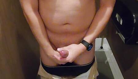 Shirtless in toilet stall cum