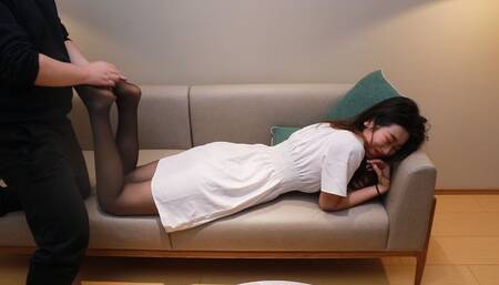 Sexy Chinese girl tickling on sofa