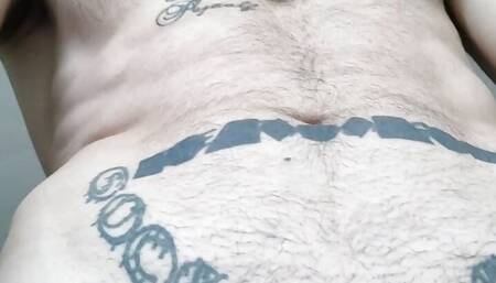 Showing hairy chest and uncut cock