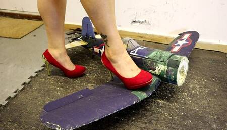 radio controlled aeroplane crush in red high heels