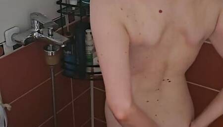 I help my friend's wife dry her bare hair with a hair dryer.