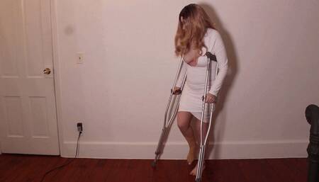 M - Sprained ankle walking with crutches wrapped bandaged foot