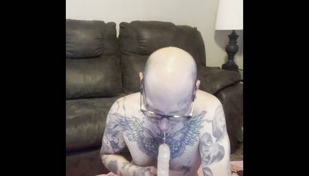 Tattooed Cuckold Sucks Dick