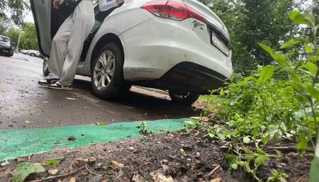 girl rocks the car from side to side, the car bumper bounces and shakes