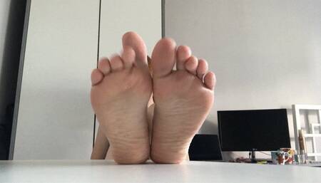 Soles on desk!