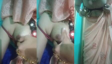 Indian trans woman Gaurisissy pressing and milking her boobs in pink saree