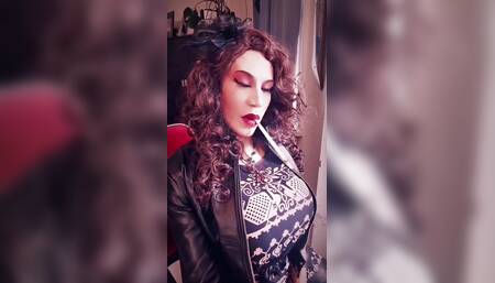 Leather trans girl with big cock smoking a long cigarette