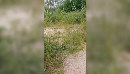 Sexy guy walks in the woods and jerks off his cock in his tight sweatpants