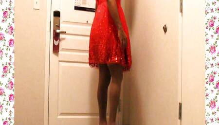 A 1950's SISSY DANCE FOR HER HUSBAND WEARING A PARTY DRESS