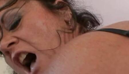 Racy MILF De Bella gets grabbed, kissed, rubbed, and fucked by two horny guys